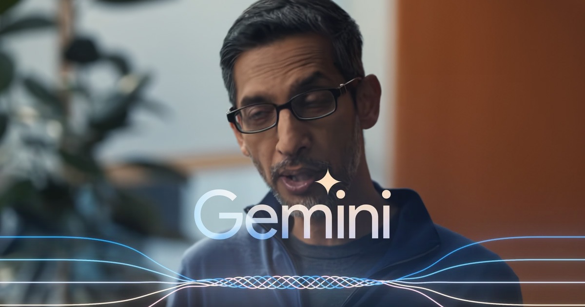 An unflattering video frame of Sundar Pichai taken from Gemini's introduction. Gemini's logo is visible at the bottom of the image.